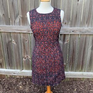 McGinn sheath dress, laser cutouts, pockets, size 4